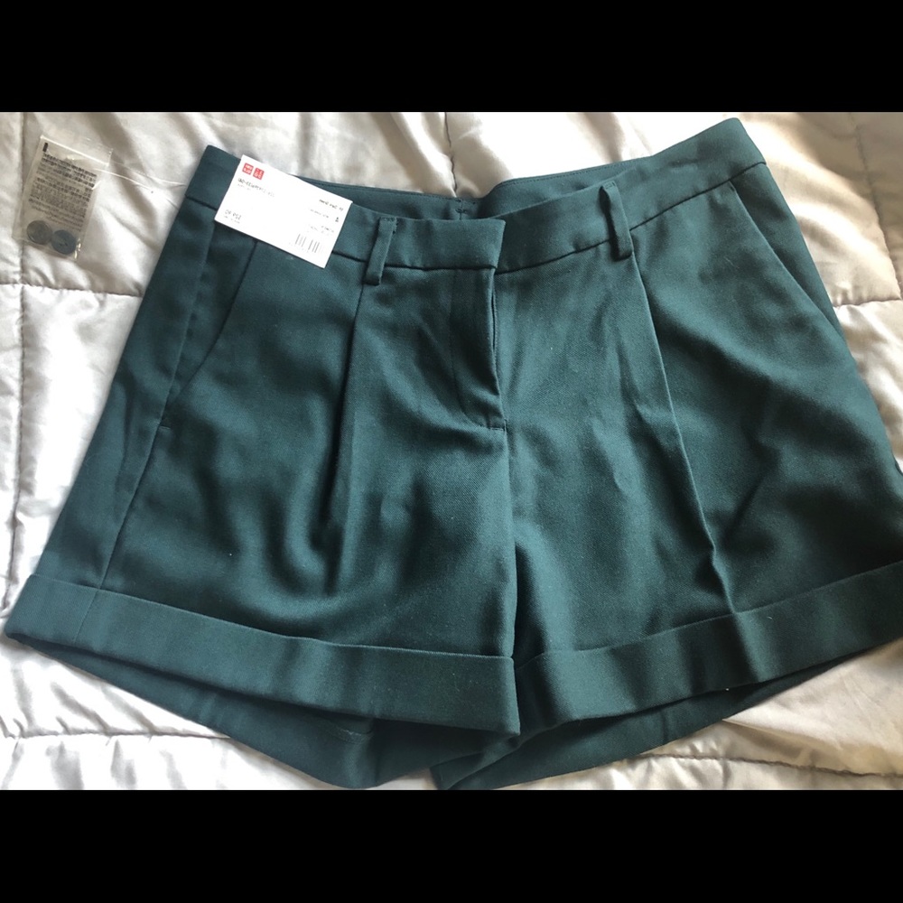 Green pleated shorts